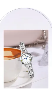 Close-up of GEDI silver quartz watch featuring rhinestone markers and hollow metal bracelet