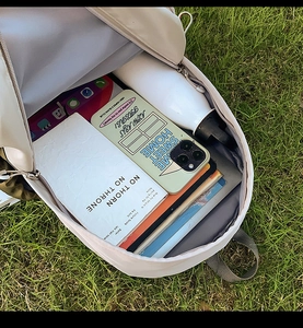 Spacious interior of lightweight kids backpack showing tablet and books storage