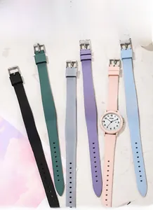 Flat lay of colorful GEDI silicone quartz watches with date display on marble background