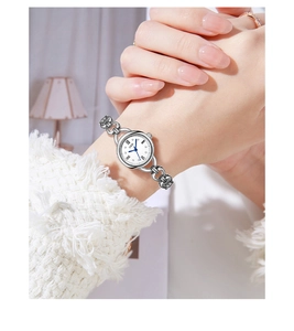Detail view of GEDI silver chain watch with Roman numerals on elegant white dial