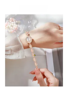Close-up of rose gold oval watch featuring diamond-encrusted bezel and mother-of-pearl dial