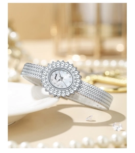 Detail of silver quartz watch with crystal sunflower bezel and woven metal strap