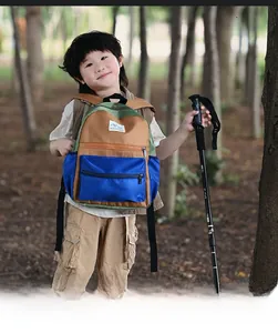 Kids outdoor backpack with colorful patchwork design and side mesh pocket for water bottles