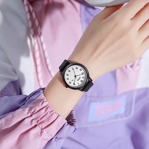 GEDI minimalist candy-colored quartz watch with black silicone strap and round white dial