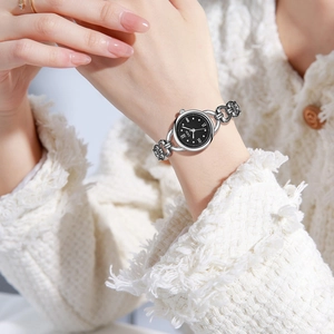 Elegant silver chain bracelet watch for women with round black dial and Roman numerals
