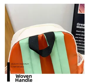 Detail view of woven handle and contrast color straps on durable school backpack