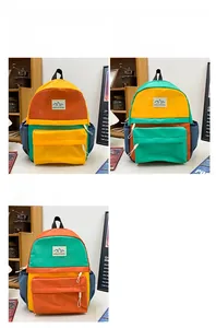 Detailed comparison of color-block school backpacks in yellow, green and brown nylon