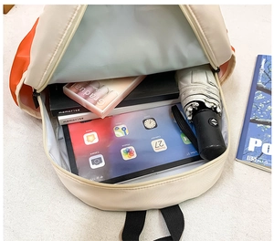 Detailed interior of high-capacity school backpack showing storage for tablets and books