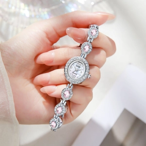 Elegant silver quartz watch with pink gemstones and Roman numeral dial for women