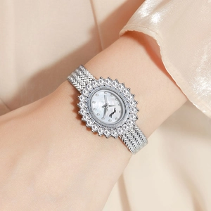 Elegant ladies quartz watch with silver wheat-inspired rhinestone bezel and oval dial