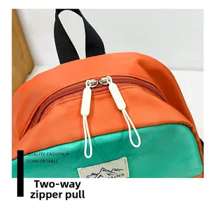 Detail of high-density nylon fabric and smooth two-way zippers with white pull tabs