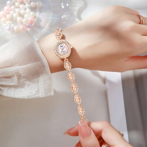 Elegant oval rose gold watch with sparkling diamonds and pink gemstone bracelet for women