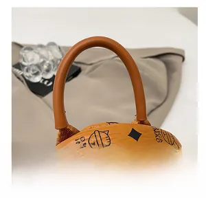 Close-up of litchi texture faux leather backpack with cartoon print and sturdy handle