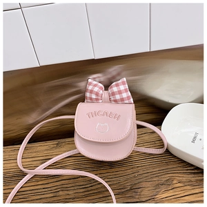Pink mini crossbody bag for kids with red plaid bow and embroidered cat face detail