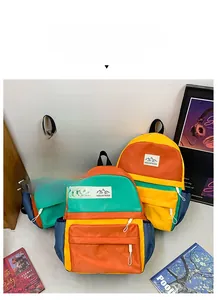 Vibrant color-block school backpacks with MOUNTAINS logo and multiple pockets for kids