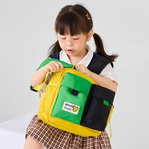Cartoon color-block preschool backpack for kids featuring bear patch and vibrant yellow green design