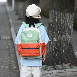 Large capacity color-block children's backpack in mint green and beige for school kids