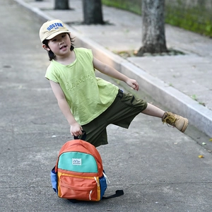 Vibrant color-block children's backpack with MOUNTAINS patch for school and outdoor use