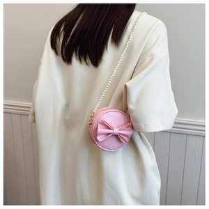 Mini sac rond rose pour fille avec nœud décoratif et bandoulière en perles blanches