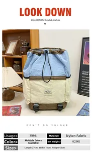 Detailed view of color-block nylon backpack with 27x16x42cm dimensions and mountain logo