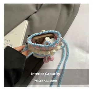 Detail showing the internal storage capacity of the handmade knit rainbow bucket bag
