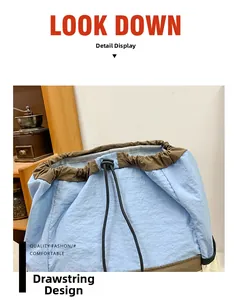 Detail of the drawstring closure on blue and brown nylon backpack with adjustable buckle