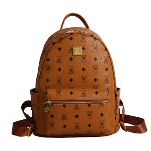 Brown backpack featuring cute bear prints and gold logo plate for women's daily travel