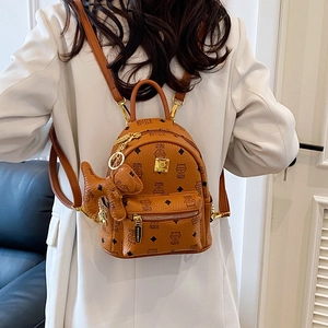 Women's mini brown backpack with cute cat patterns and small dog charm accessory