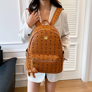 Sac à dos marron en cuir à grande capacité avec imprimé logo et charm éléphant