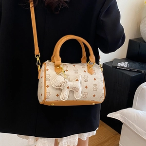 Chic cartoon cat print Boston bag with dog charm and brown handles for stylish women