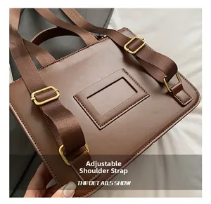 Detail view of the adjustable backpack shoulder strap with premium gold metal buckle