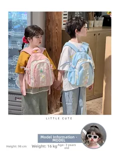 Toddler backpacks with colorful stars and drawstring detail shown on child models