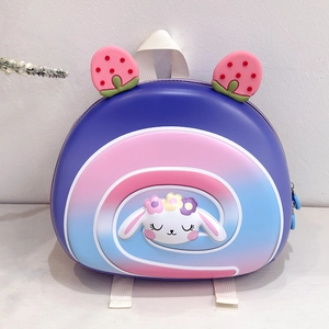 Detail of cute purple hard shell kids backpack with bunny and strawberry decoration
