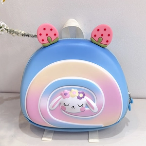 Close-up of cute rabbit motif on blue hard-shell kids backpack with strawberry decor