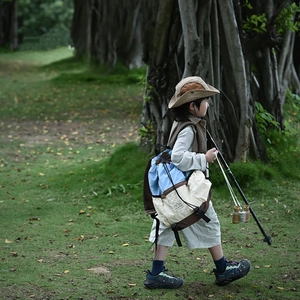 Toddler outdoor backpack in blue and beige tricolor design with mountain logo detail