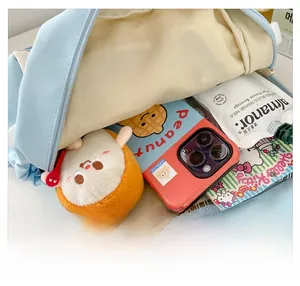 Spacious interior of a cute star backpack with space for phone, toys, and stationery