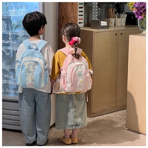 Children carrying cute star backpacks with drawstrings in a cafe setting outdoors