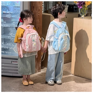 Kids star pattern backpack with drawstring closure and cute star pendant detail