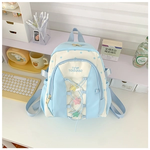Detail of blue student backpack with star prints and decorative lace-up front design