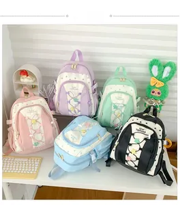 Detailed display of five colorful macaron schoolbags with star prints and drawstrings