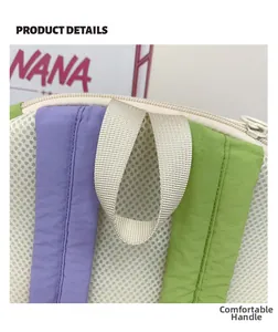 Détail de la poignée en nylon confortable et du tissu en maille durable sur le sac à dos