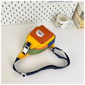 Detail of color-block kids crossbody bag with mountain patch and adjustable strap