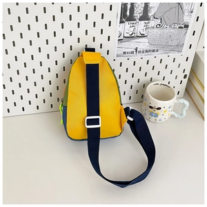 Macro view of multi-color nylon kids crossbody bag with yellow, green and blue panels