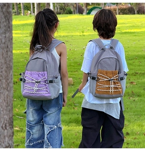 Close-up of large capacity school backpack with drawstring pocket and mesh side pouches