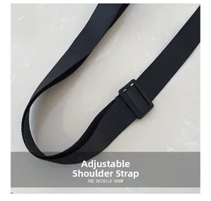 Detail shot of the adjustable black nylon shoulder strap with a durable plastic buckle