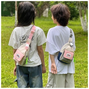 Detailed view of kids color-block crossbody chest bags with adjustable straps and buckles