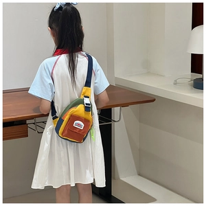 Detail of color-block kids crossbody chest bag with adjustable strap and BOUDING patch