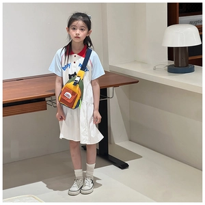 Kids colorful canvas crossbody chest bag shown on model for size and fit reference