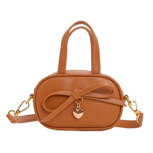 Brown mini crossbody bag for kids with bow detail and gold heart pendant decoration
