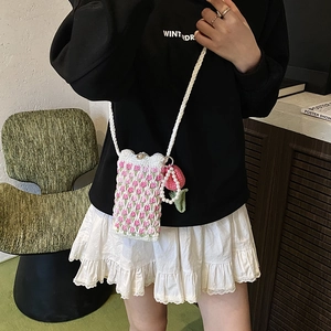 Handmade crochet shoulder bag featuring 3D pink floral patterns and a cute flower pendant
